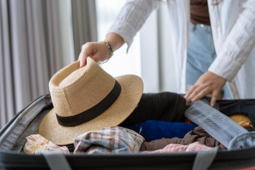 woman packing suitcase